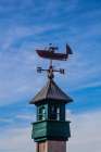 USA-New England-Maine-Mt-Desert Island weather vane topped with a fishing boat Art Print